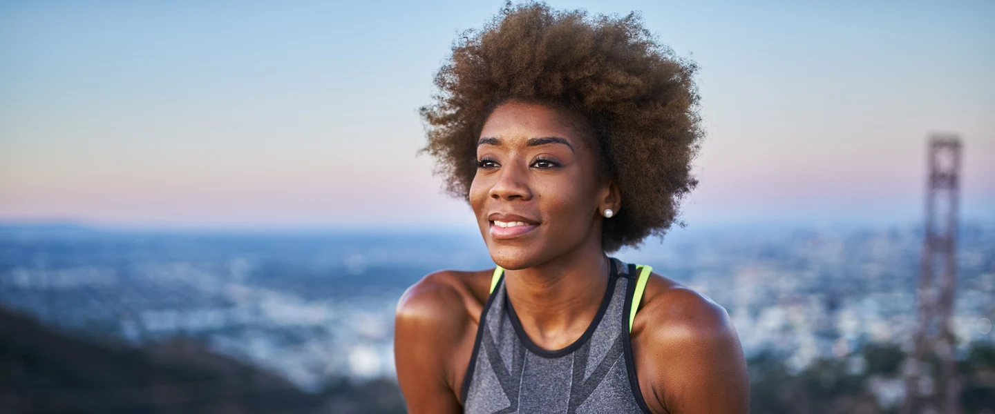 Woman stretching in bed in the morning