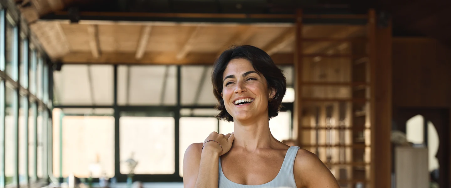 Woman stretching in bed