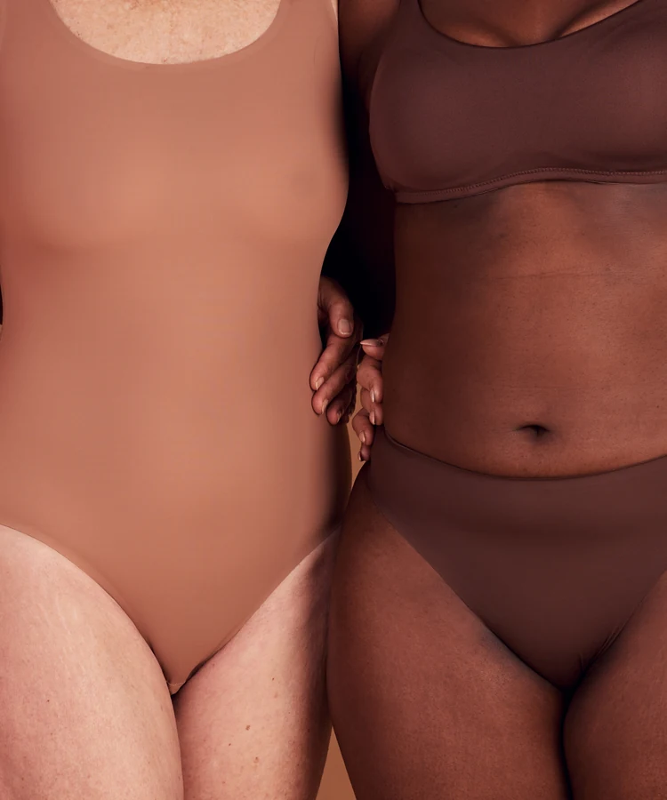 Diverse women of different body types standing together in confidence promoting body positivity and wellness